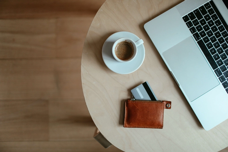 An open leather wallet on the ground. - Cup of Couple / Pexels An open leather wallet on the ground. - Cup of Couple / Pexels