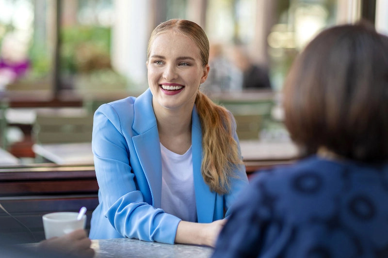 Woman smiling at a cafe Woman smiling at a cafe
