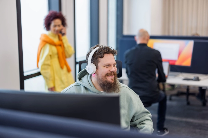 Man with headphones at work Man with headphones at work