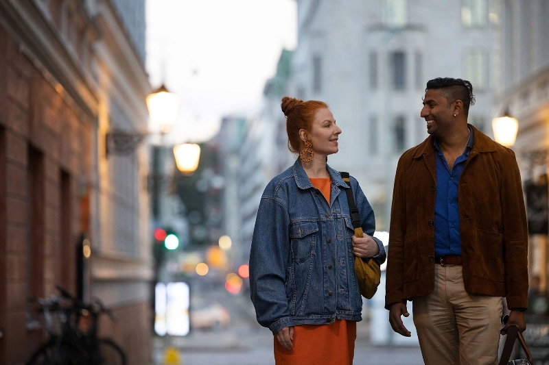 Woman and man on a street talking Woman and man on a street talking